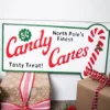 23.6” Metal Holiday North Pole’s Finest Candy Canes Wall Sign