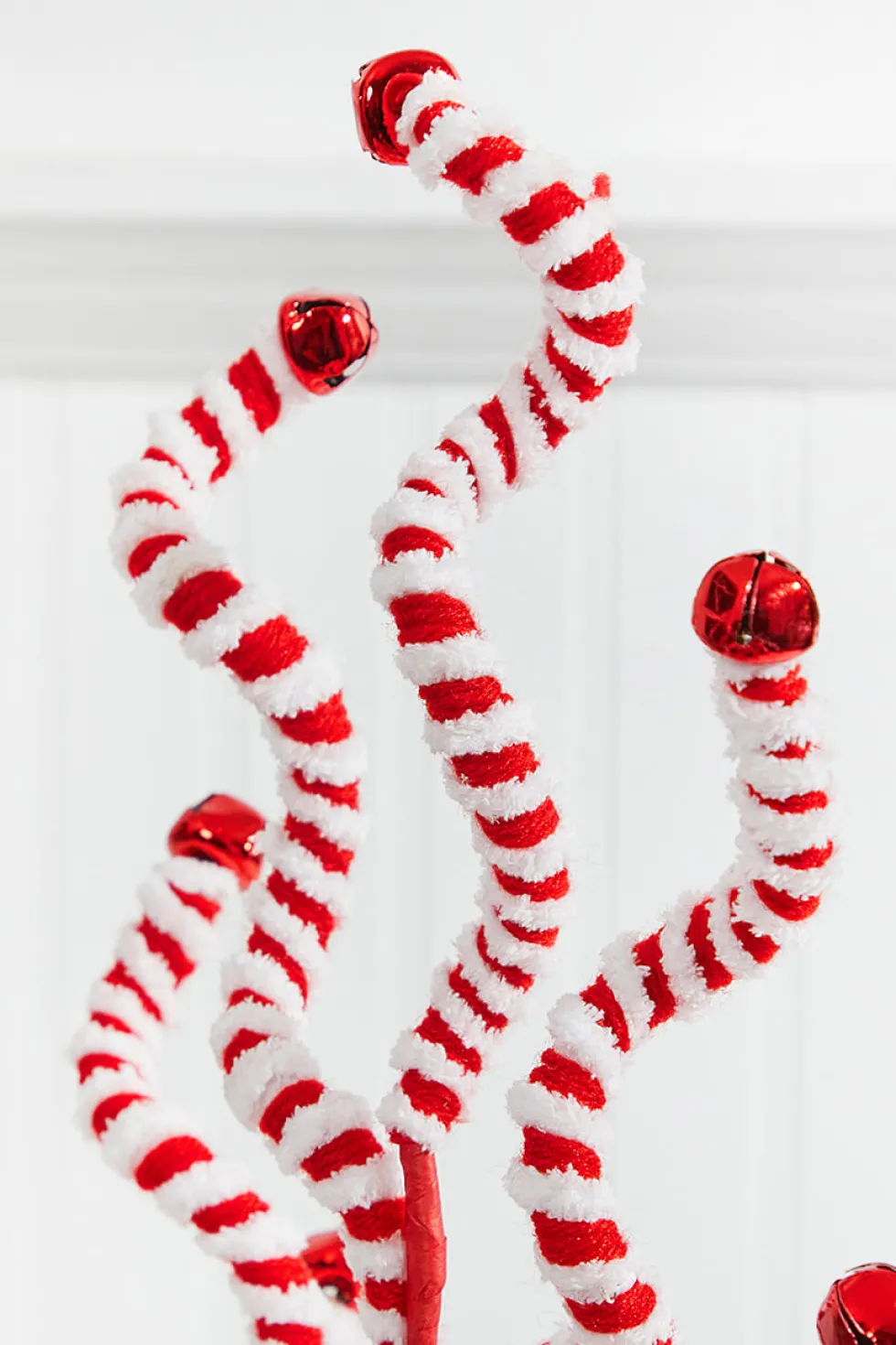 24" Red and White Fabric Peppermint Stripe Jingle Bell Spray